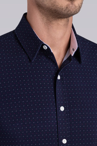 Model wearing Ignite Navy Red Icy Cotton® long sleeve shirt with classic collar and placket, styled with khaki pants