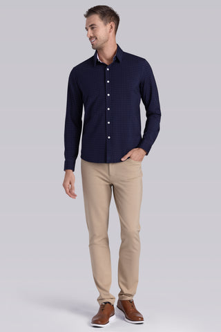 Model wearing Ignite Navy Red Icy Cotton® long sleeve shirt with classic collar and placket, styled with khaki pants