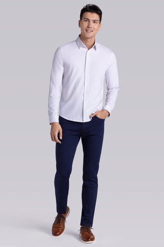 Model wearing Ignite White Icy Cotton® long sleeve shirt with classic collar and placket, styled with navy pants