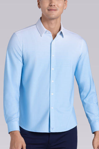 Model wearing Flex Light Blue Icy Cotton® long sleeve shirt with classic collar and french placket, styled with black pants.