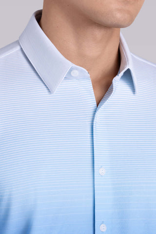 Model wearing Flex Light Blue Icy Cotton® long sleeve shirt with classic collar and french placket, styled with black pants.