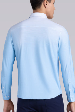 Model wearing Flex Light Blue Icy Cotton® long sleeve shirt with classic collar and french placket, styled with black pants.