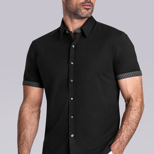 Model wearing Established Black short sleeve classic collar shirt, style with white shorts