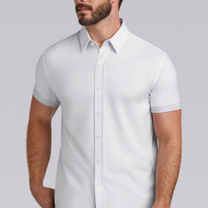 Model wearing Iconic Rapport White short sleeve classic collar shirt, styled with black pants