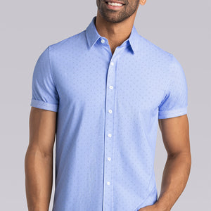 Model wearing Sincerity Palace Blue short sleeve collar shirt, styled with navy pants.