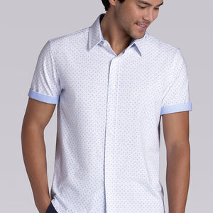 Model wearing Exhilarate White short sleeve shirt, styled with black shorts
