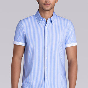 Model wearing Stamina Santorini Blue short sleeve classic collar, styled with navy pants