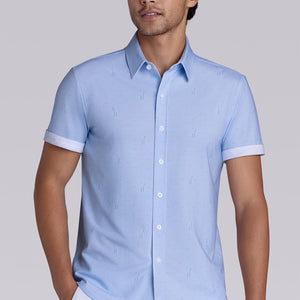 Model wear Intrepid Light Blue short sleeve print shirt, styled with white shorts.