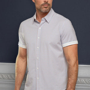 Model wearing Sanguine Ocean Blue short sleeve casual shirt with collar, styled with navy pants.