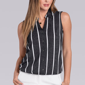 Model wearing Harmony Black White Icy Bamboo® sleeveless v-neck shirt, styled with white pants.